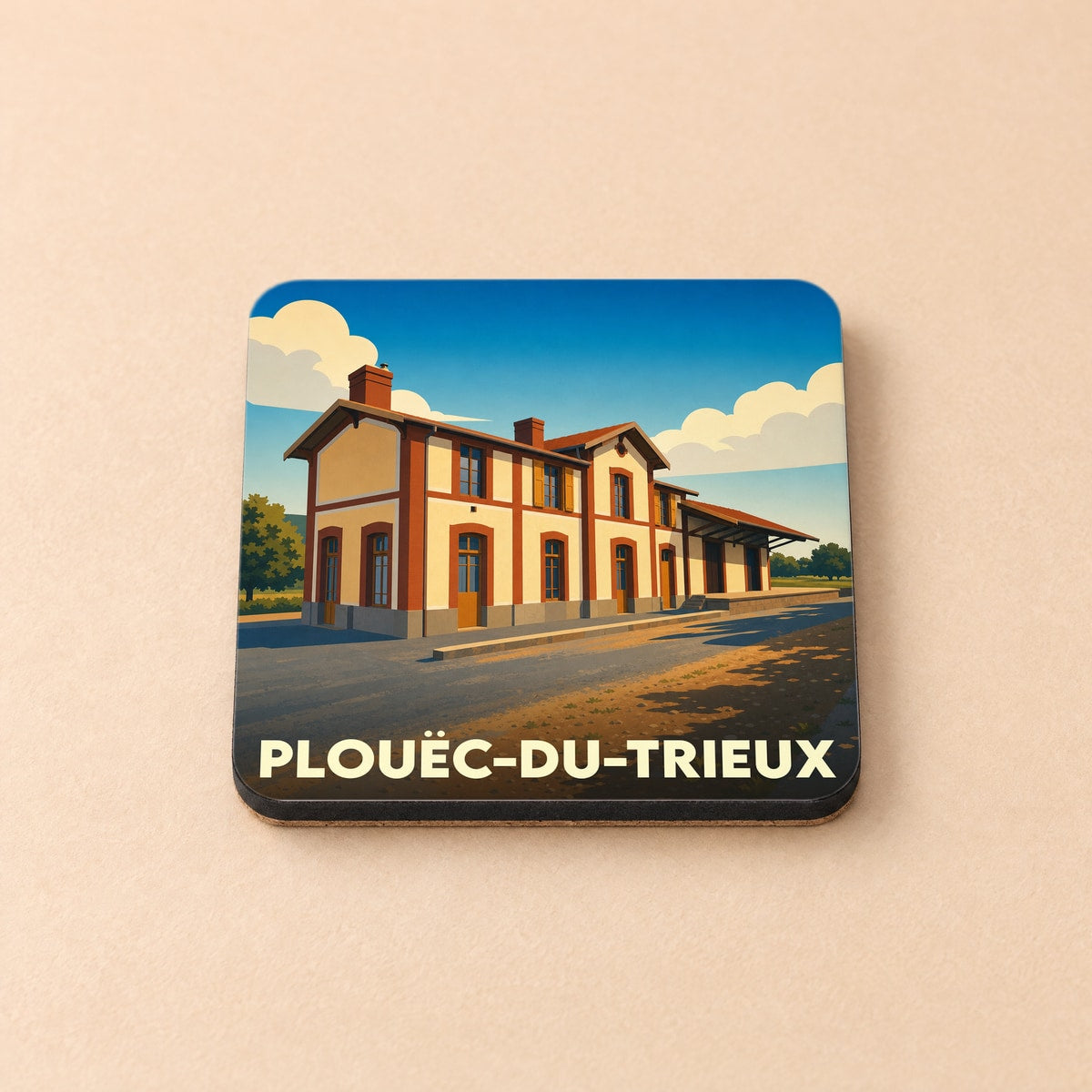Dessous de verre souvenir de la ville de Plouëc-du-Trieux avec une illustration stylisée de sa gare.