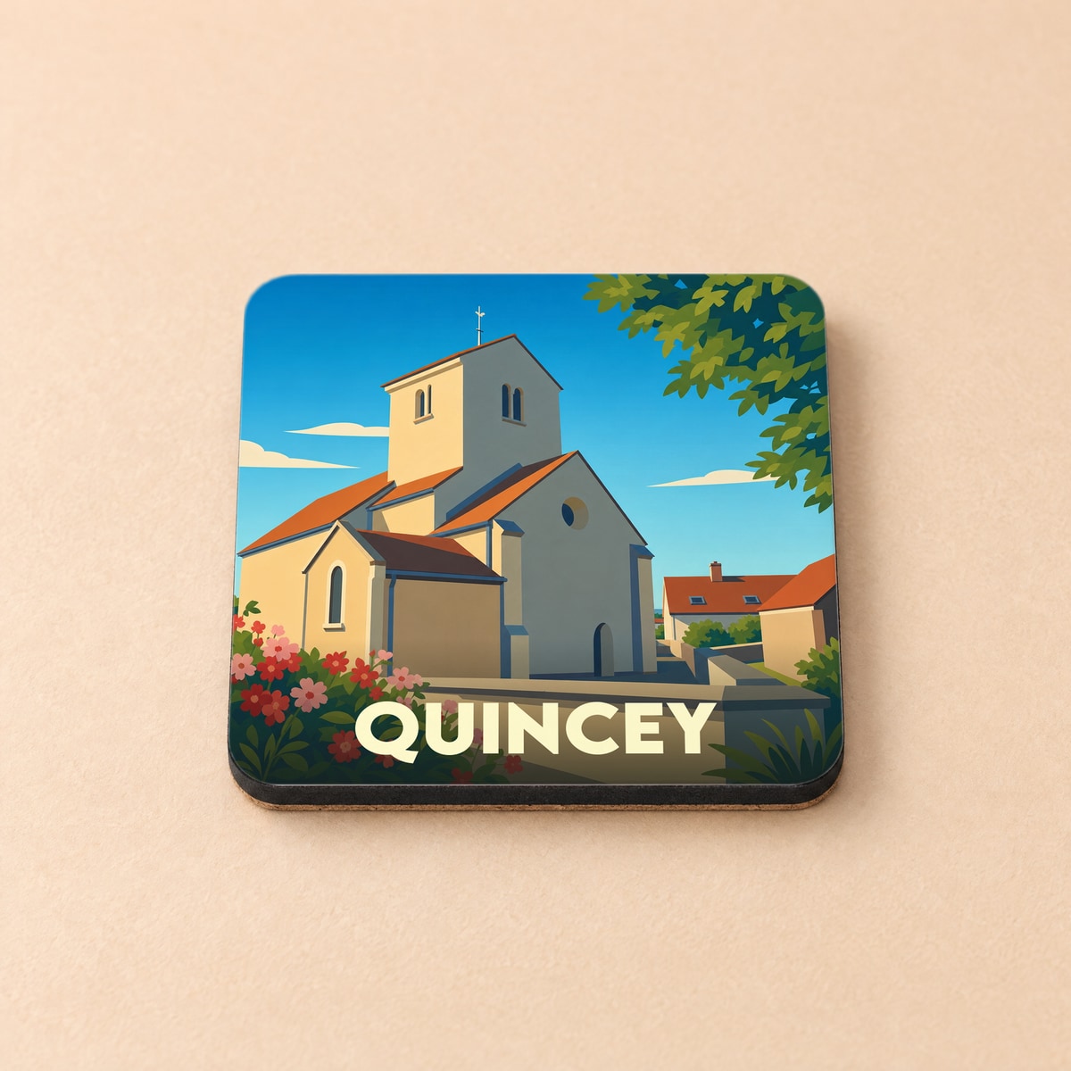 Dessous de verre souvenir de la ville de Quincey avec une illustration stylisée de son église.