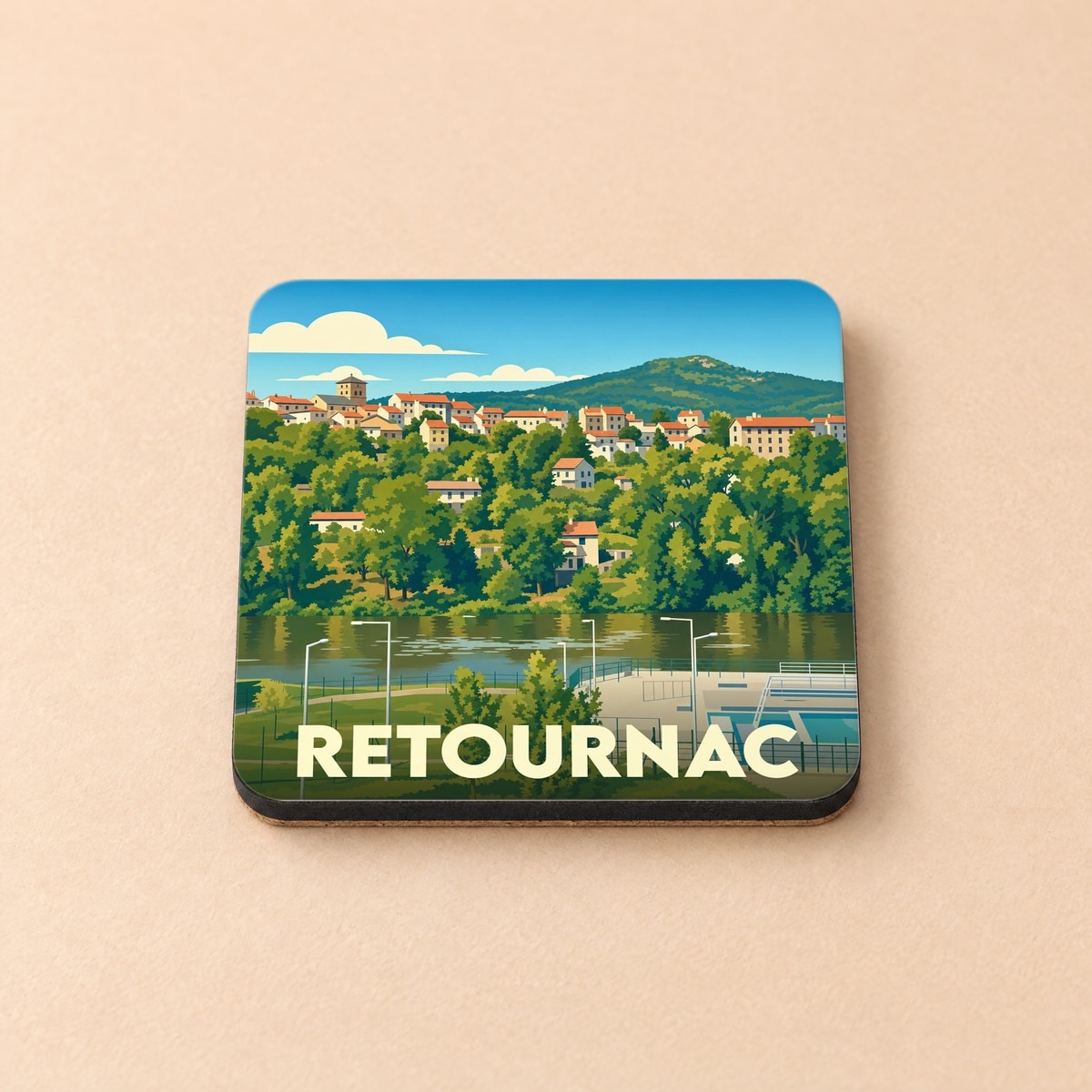 Dessous de verre souvenir de la ville de Retournac avec une illustration stylisée d'un paysage bordant la Loire.