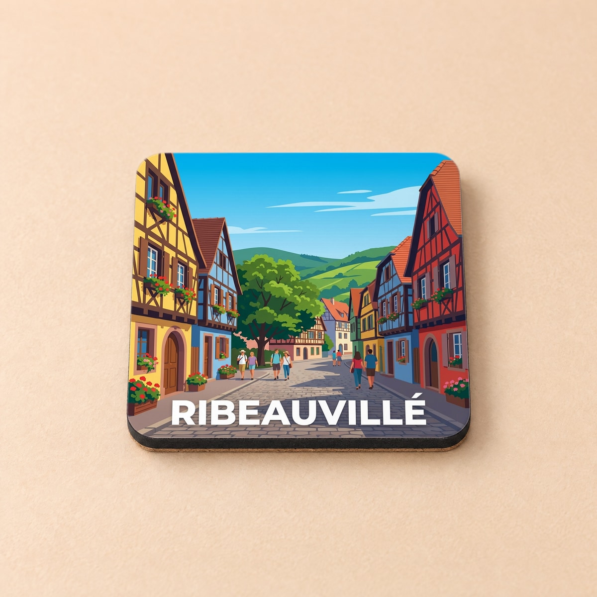 Dessous de verre souvenir de la ville de Ribeauvillé avec une illustration stylisée de ses maisons à colombages.