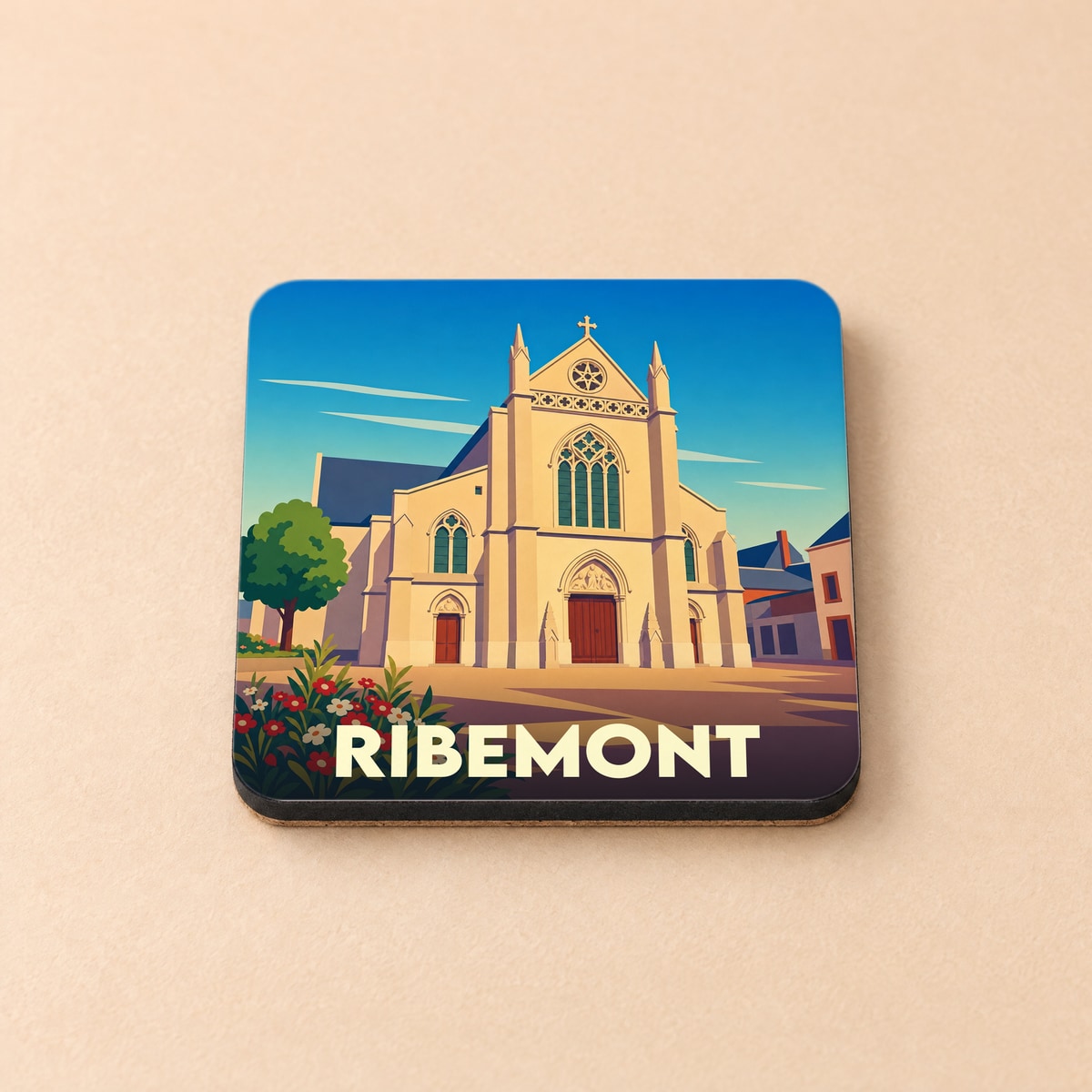 Dessous de verre souvenir de la ville de Ribemont avec une illustration stylisée de son église.
