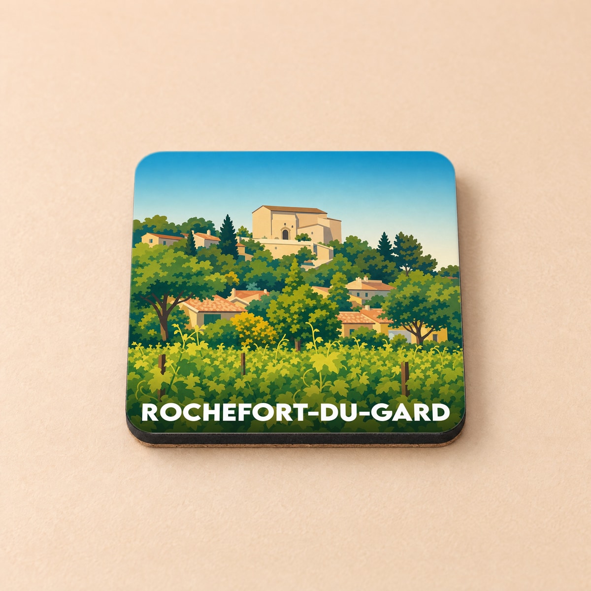 Dessous de verre souvenir de la ville de Rochefort-du-Gard avec une illustration stylisée d'un village provençal et de ses vignobles.