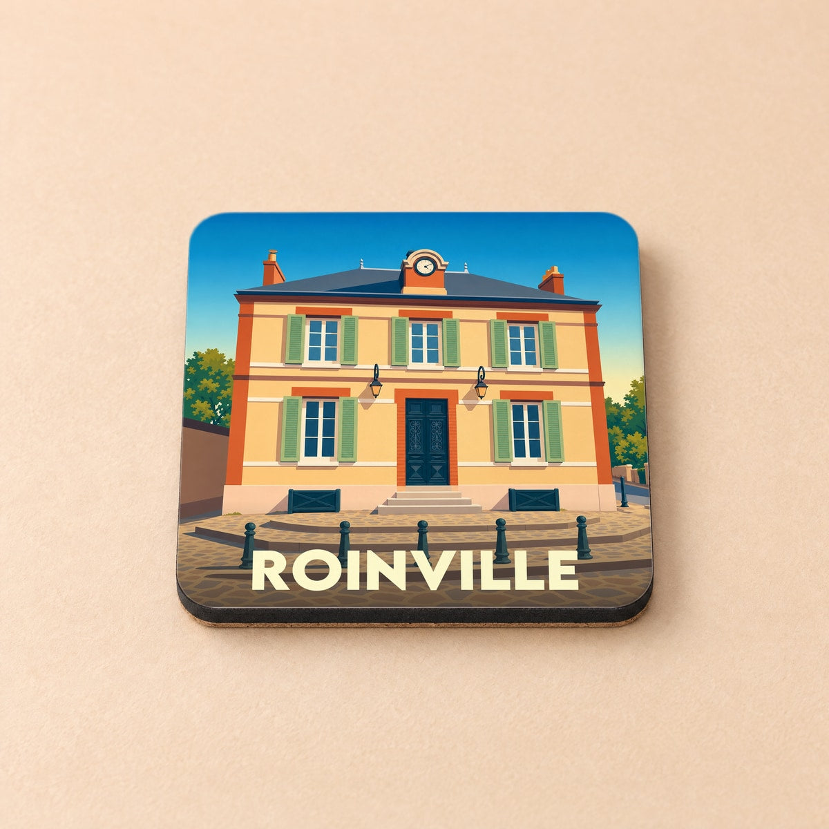 Dessous de verre souvenir de la ville de Roinville avec une illustration stylisée d'un bâtiment classique.