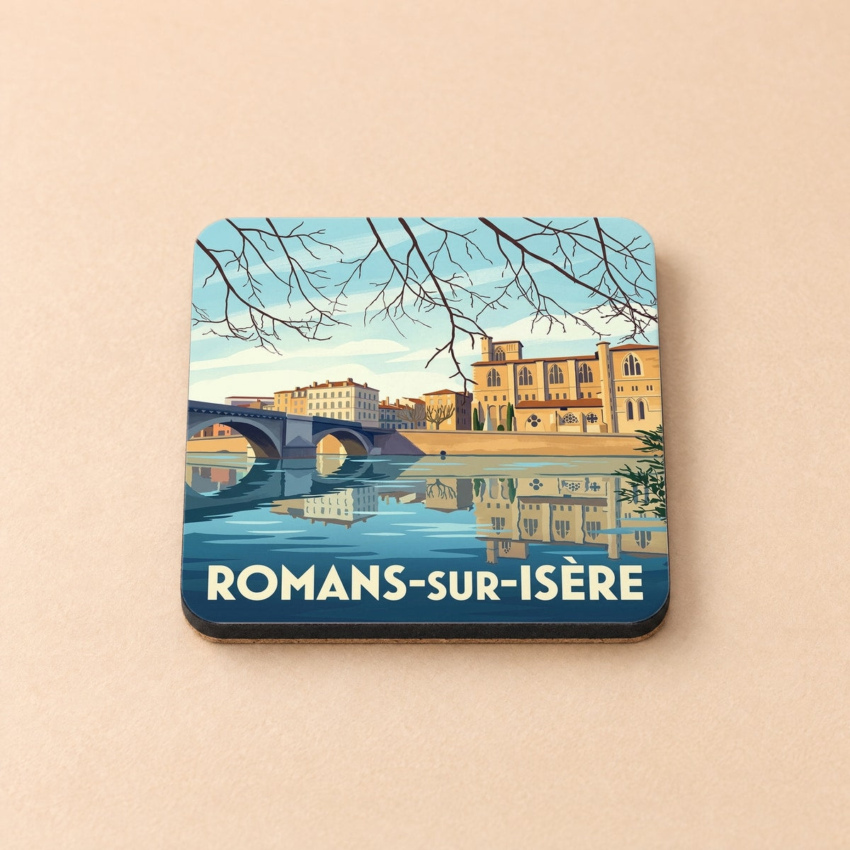 Dessous de verre souvenir de la ville de Romans-sur-Isère avec une illustration stylisée des bords de l'Isère.