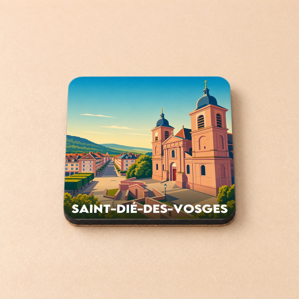 Dessous de verre souvenir de la ville de Saint-Dié-des-Vosges avec une illustration stylisée de sa cathédrale.