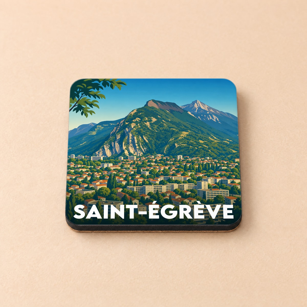Dessous de verre souvenir de la ville de Saint-Égrève avec une illustration stylisée de montagne.