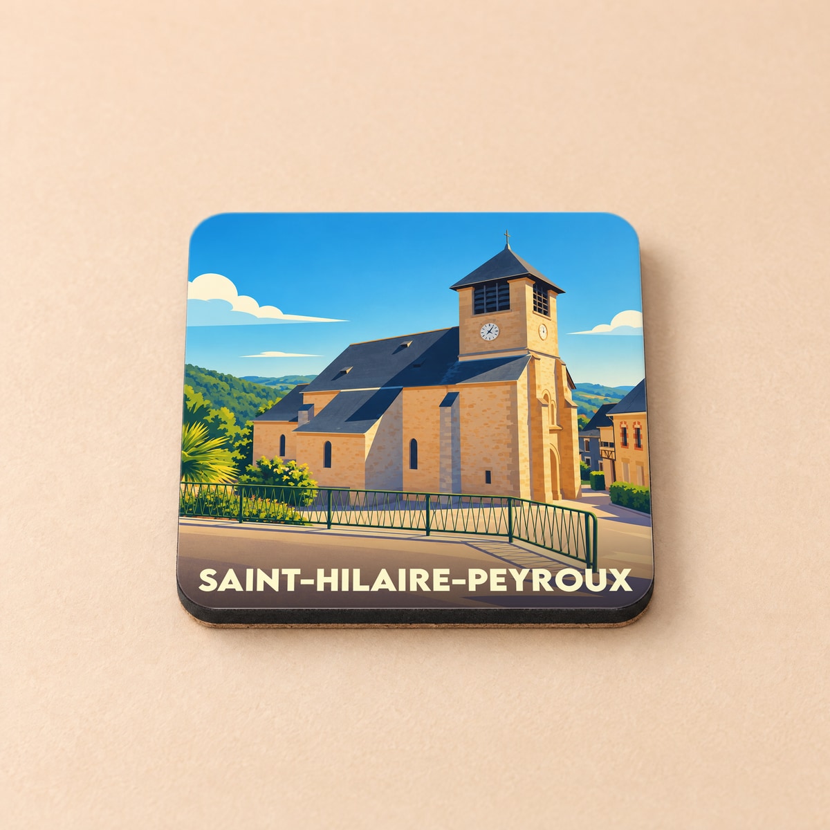 Dessous de verre souvenir de la ville de Saint-Hilaire-Peyroux avec une illustration stylisée de son église.