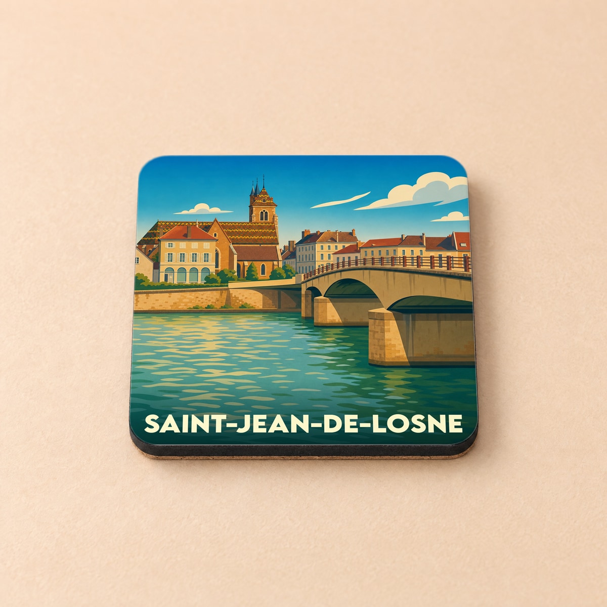 Dessous de verre souvenir de la ville de Saint-Jean-de-Losne avec une illustration stylisée d'un pont et d'une église au bord de l'eau.