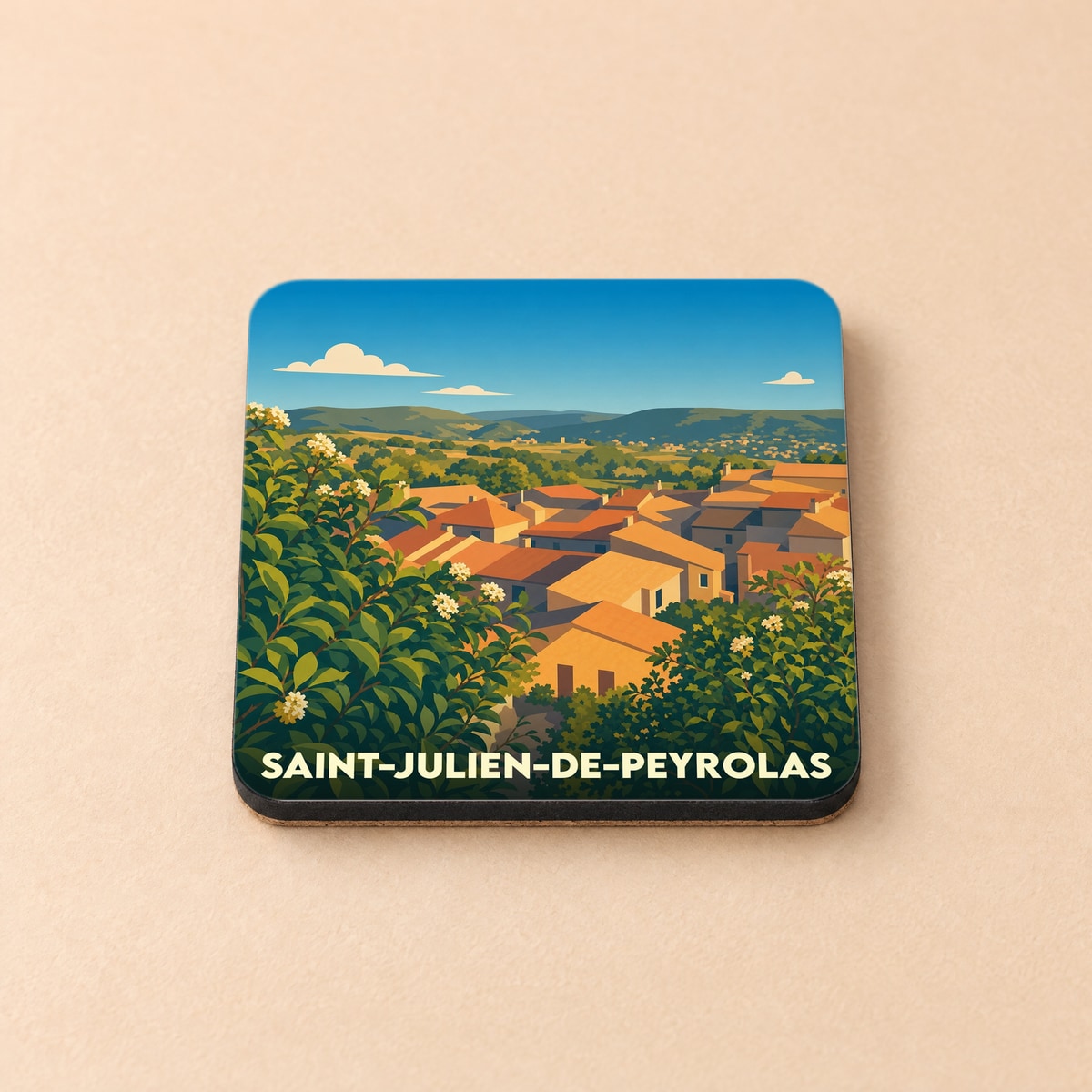 Dessous de verre souvenir de Saint-Julien-de-Peyrolas avec une illustration stylisée du village et de ses paysages.