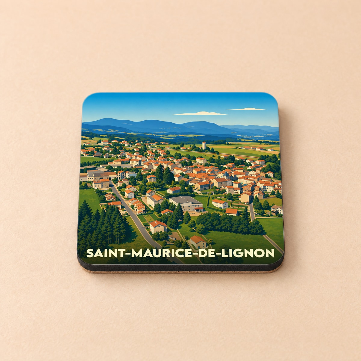 Dessous de verre souvenir de la ville de Saint-Maurice-de-Lignon avec une illustration stylisée d'un paysage urbain.
