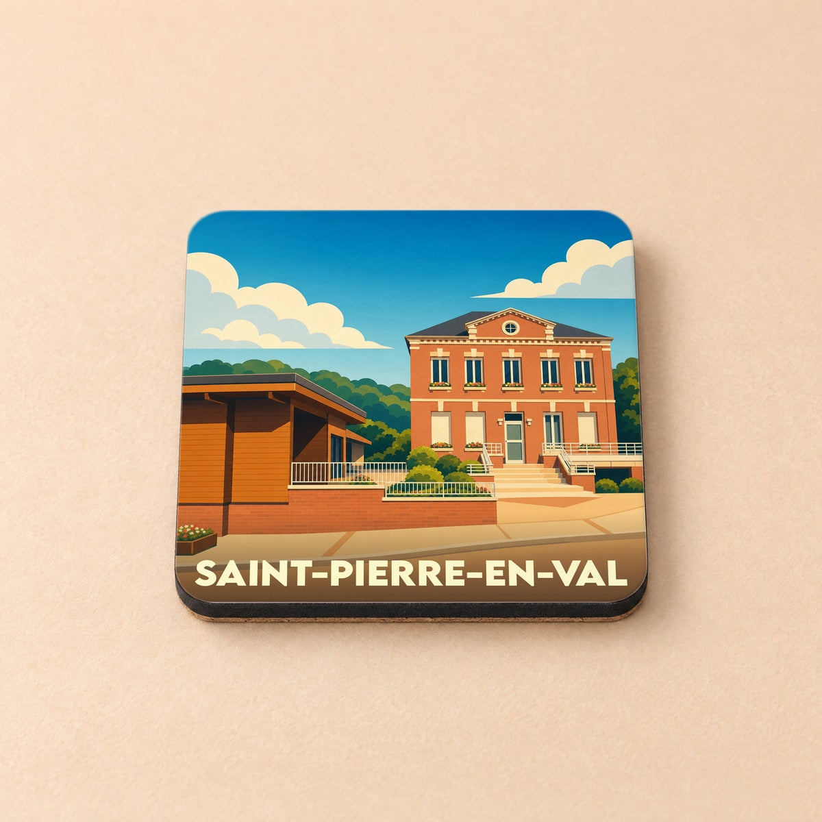Dessous de verre souvenir de la ville de Saint-Pierre-en-Val avec une illustration stylisée de son architecture.