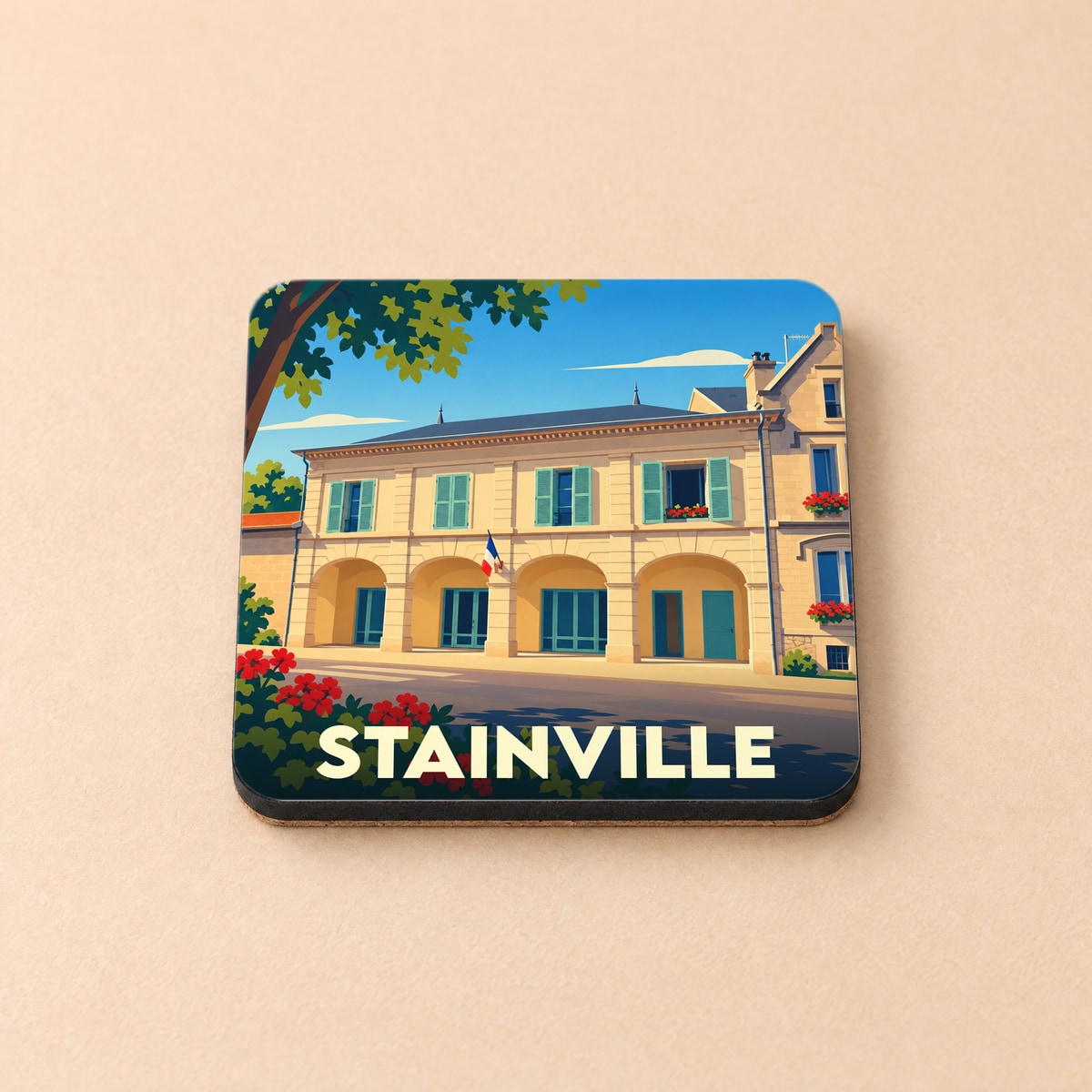 Dessous de verre souvenir de la ville de Stainville avec une illustration stylisée.