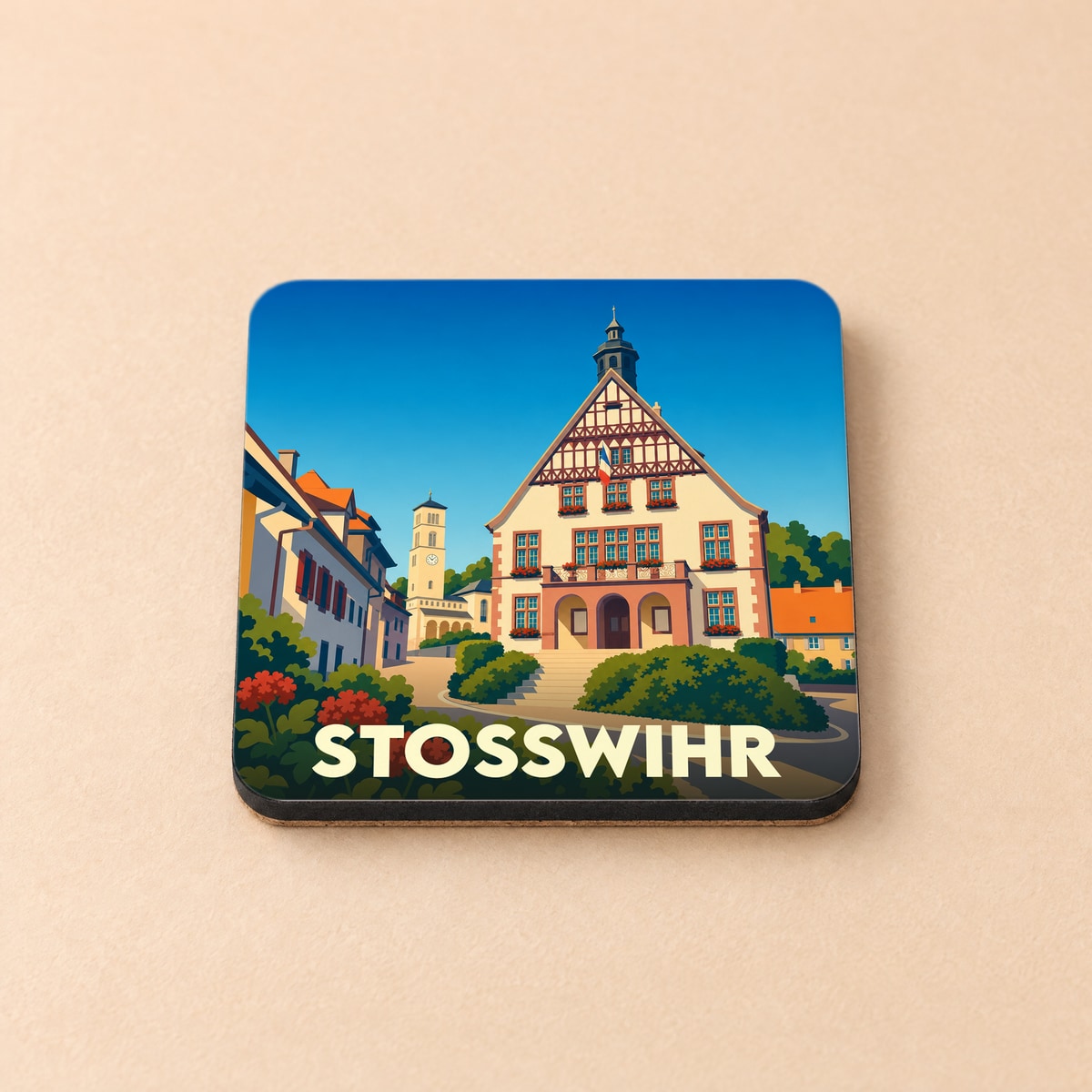 Dessous de verre souvenir de la ville de Stosswihr illustré d'un bâtiment traditionnel alsacien sous un ciel bleu.