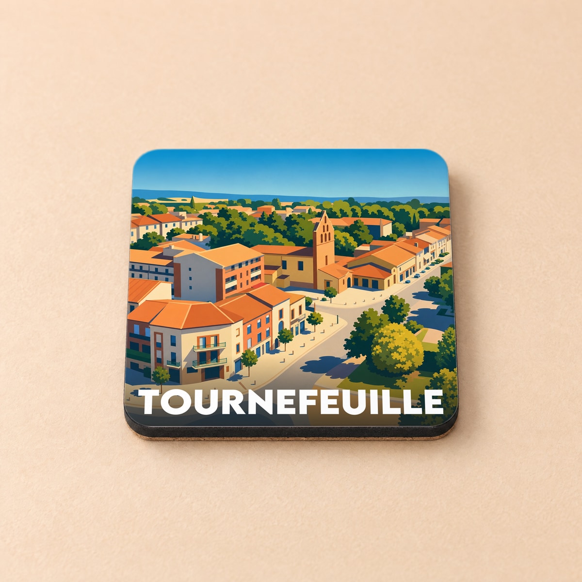 Dessous de verre souvenir de la ville de Tournefeuille avec une illustration stylisée.