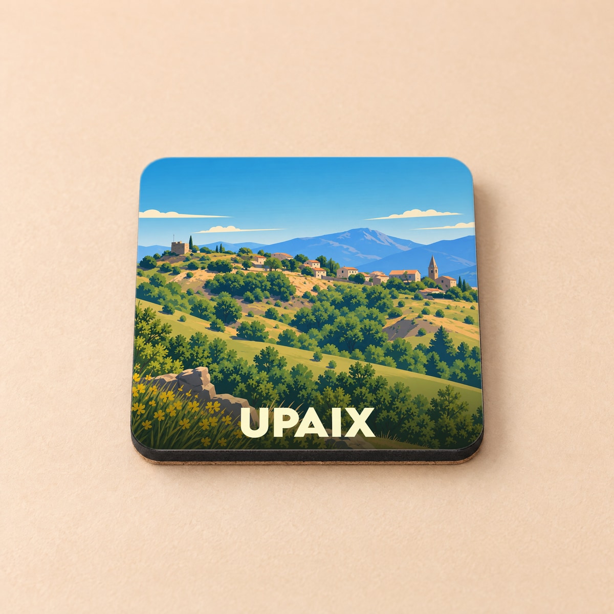Dessous de verre souvenir de la ville de Upaix avec une illustration stylisée d'un paysage provençal.