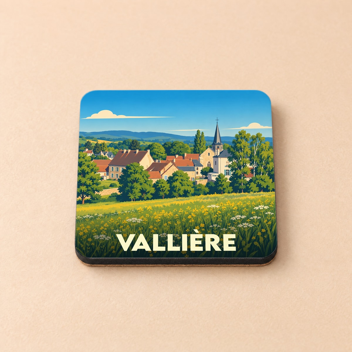 Dessous de verre souvenir de la ville de Vallière avec une illustration stylisée d'un paysage champêtre.