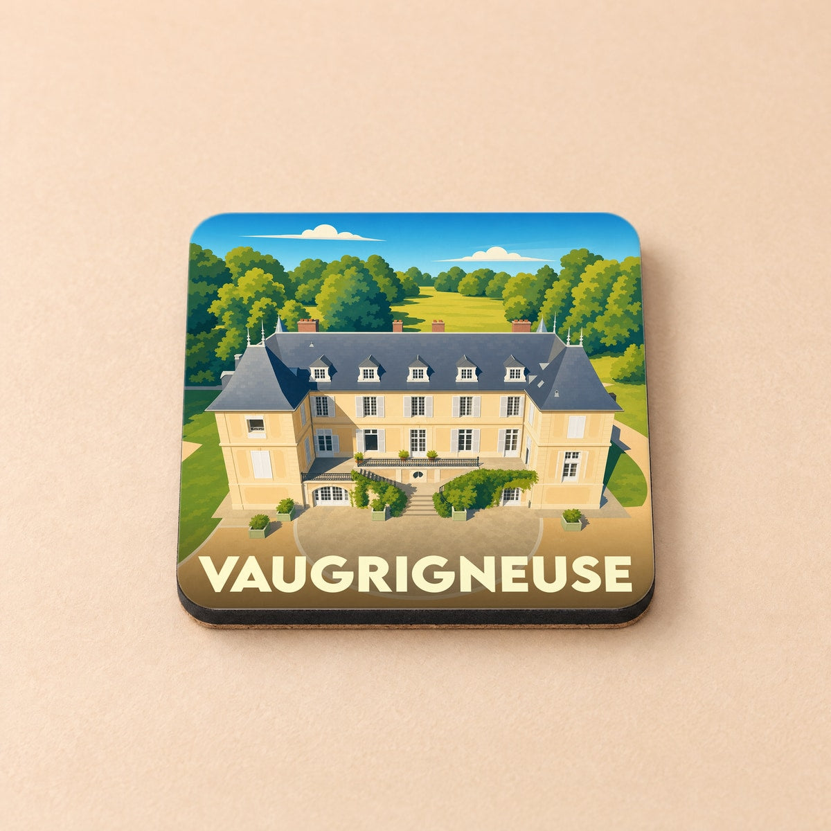 Dessous de verre souvenir de la ville de Vaugrigneuse avec une illustration stylisée d'un château.