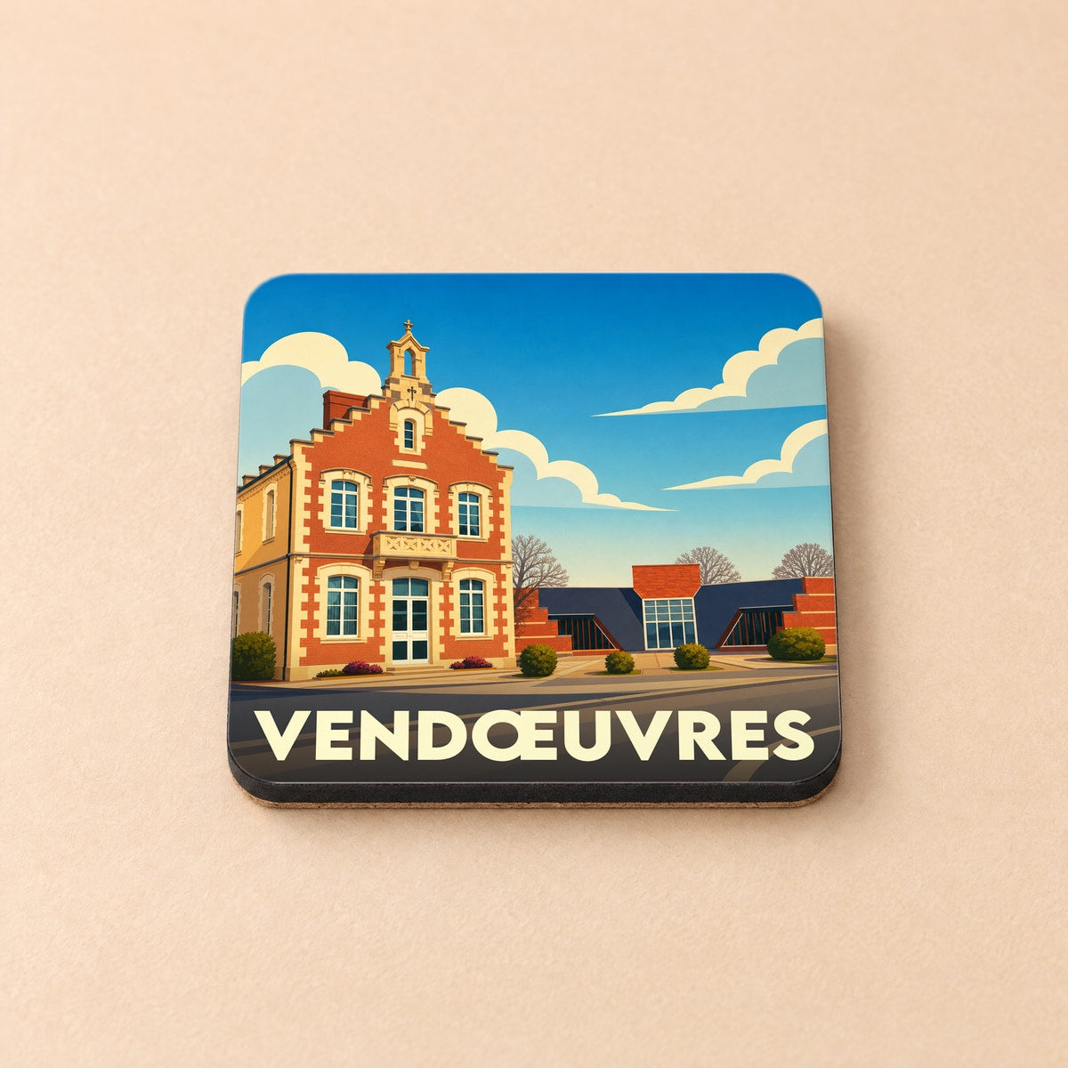 Dessous de verre souvenir de la ville de Vendœuvres avec une illustration stylisée d'un bâtiment typique.
