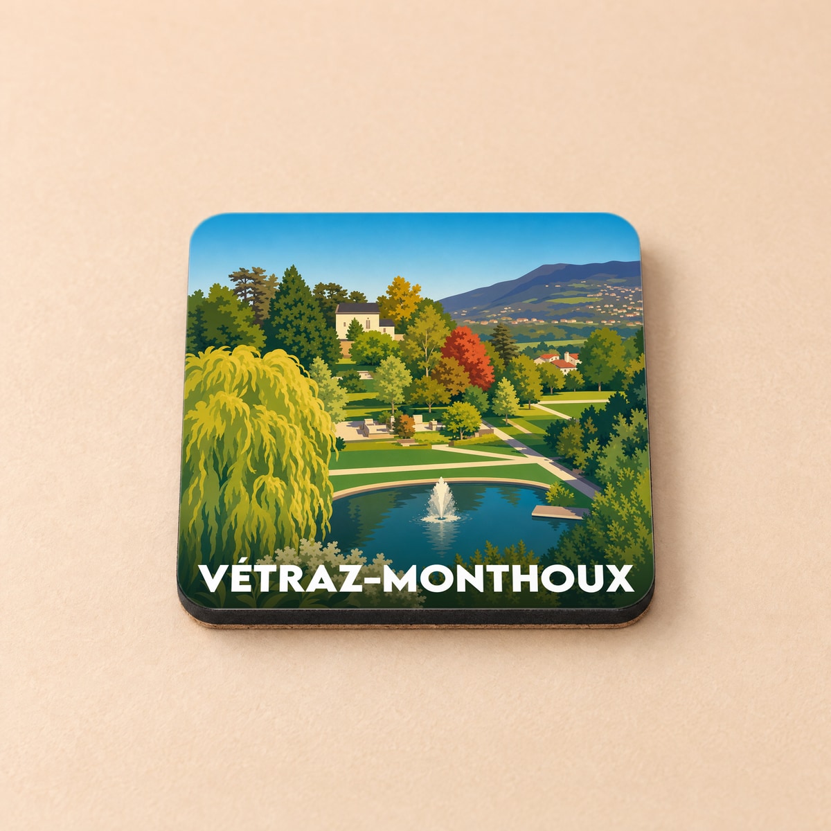 Dessous de verre souvenir de la ville de Vétraz-Monthoux avec une illustration stylisée d'un parc paysager.