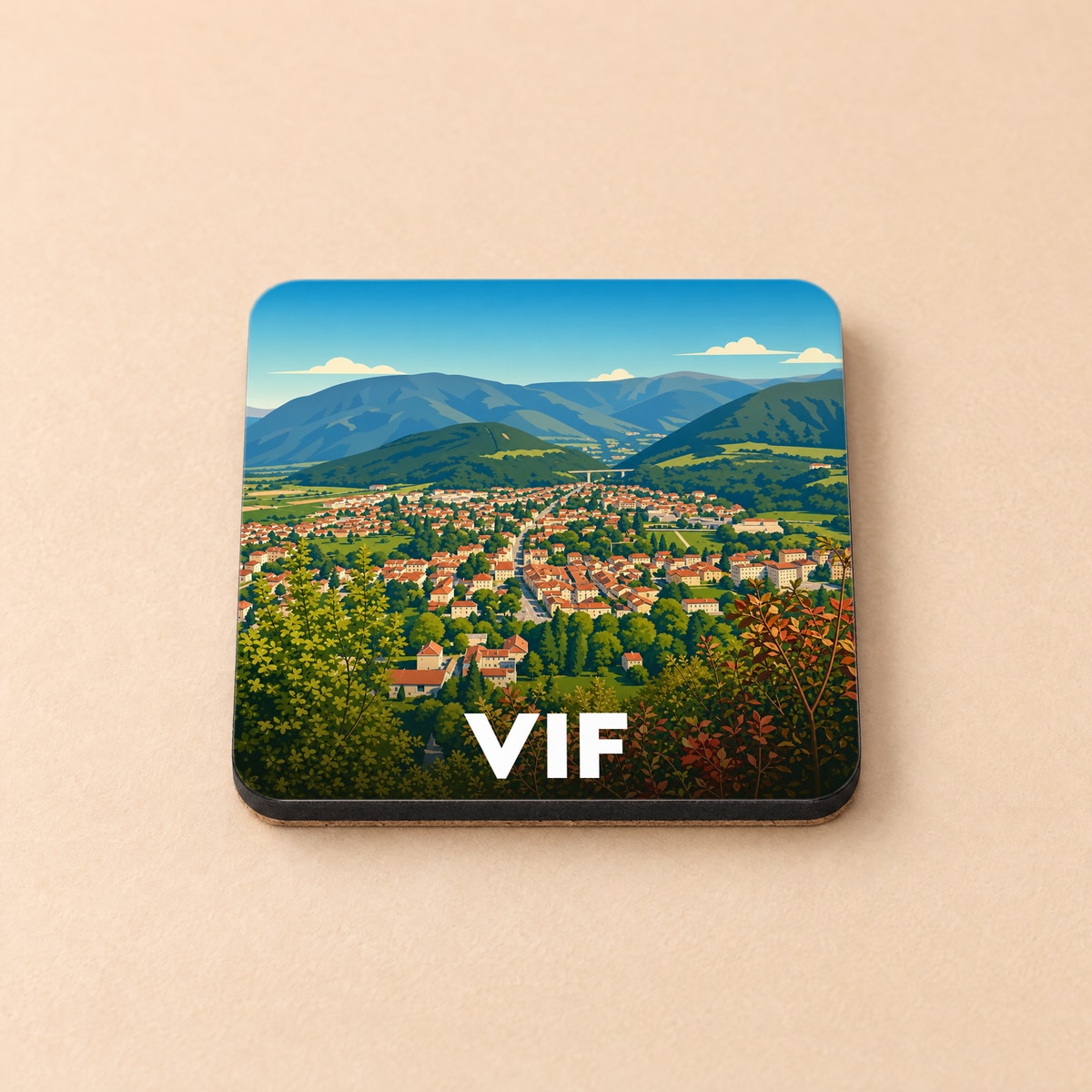 Dessous de verre souvenir de la ville de Vif avec une illustration stylisée d'un paysage montagneux.