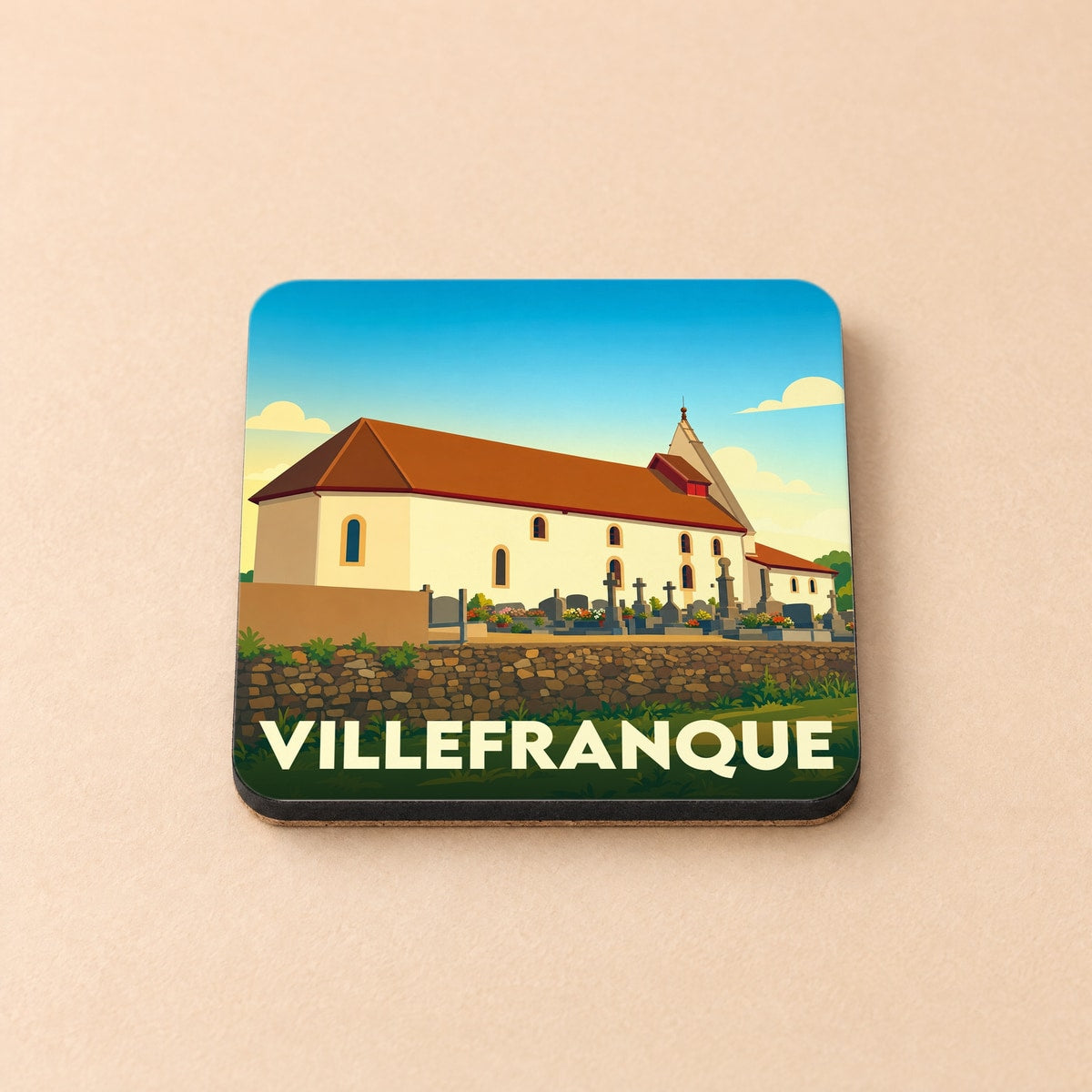 Dessous de verre souvenir de la ville de Villefranque avec une illustration stylisée de son église et de son cimetière.