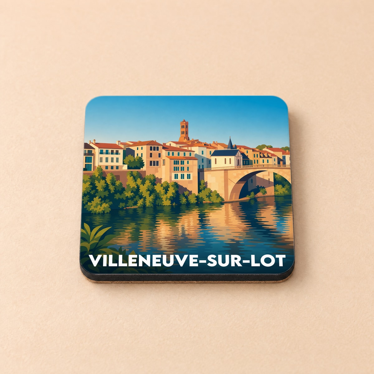 Dessous de verre souvenir de la ville de Villeneuve-sur-Lot avec une illustration stylisée des bords du Lot.