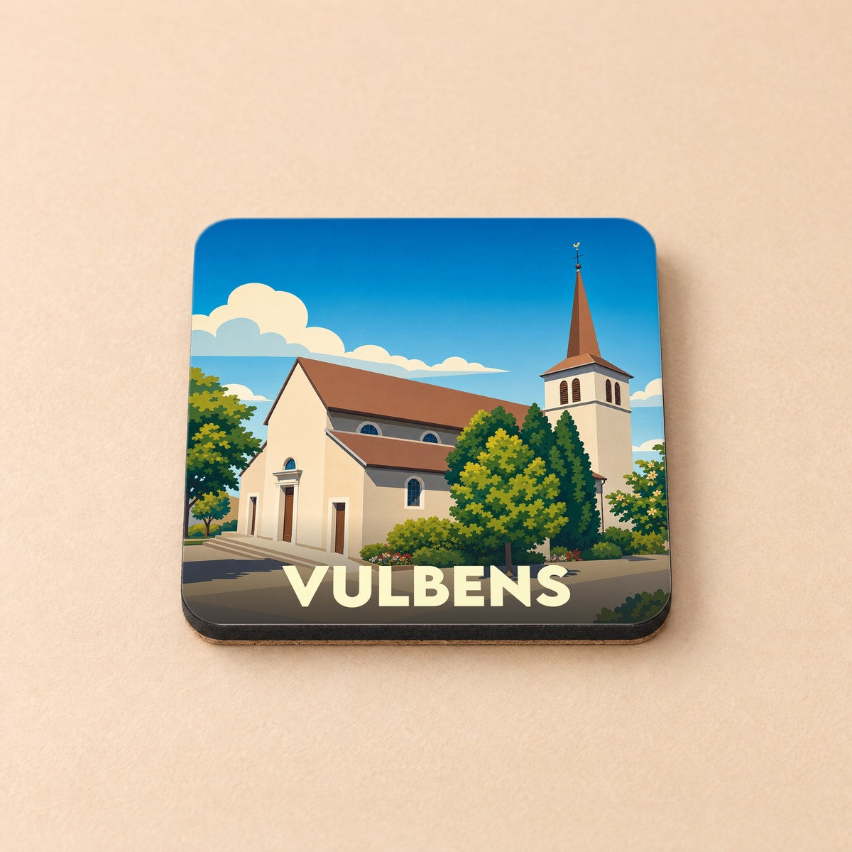 Dessous de verre souvenir de la ville de Vulbens avec une illustration stylisée de son église.