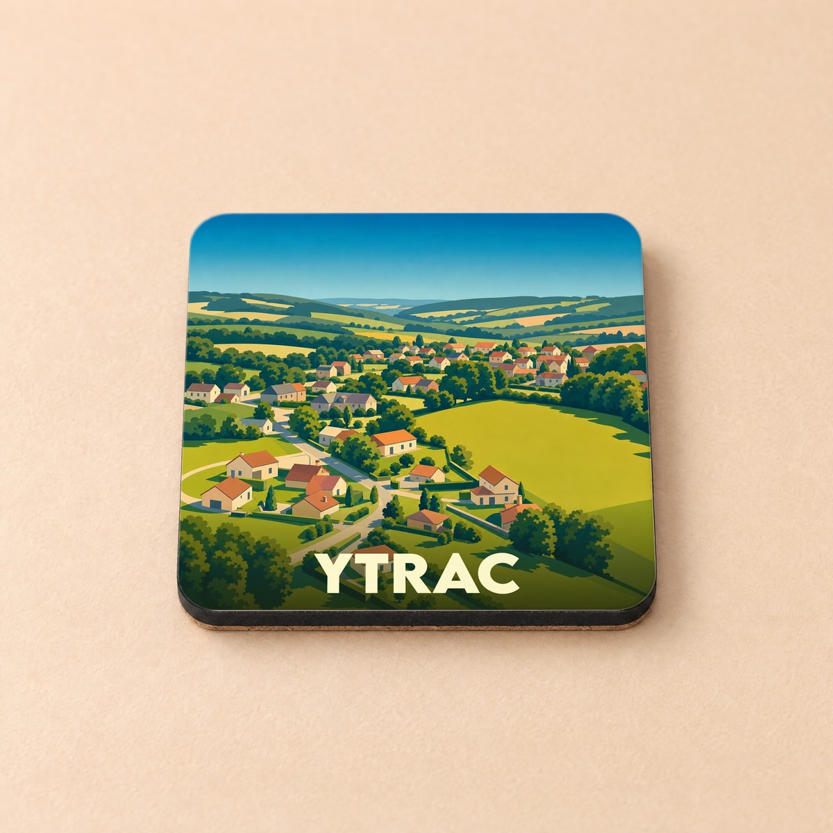 Dessous de verre souvenir de la ville d'Ytrac avec une illustration stylisée de son paysage vallonné.