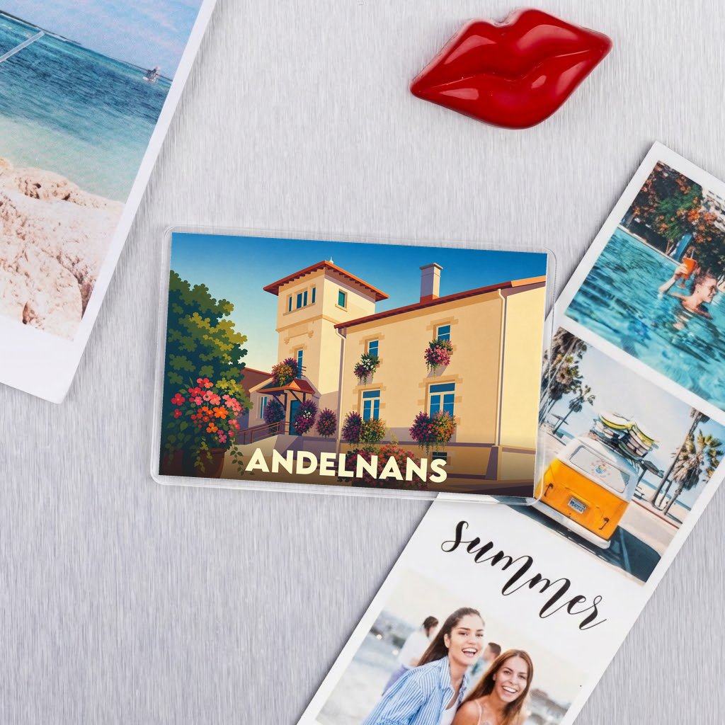 Magnet souvenir de la ville d'Andelnans avec une illustration stylisée d'un bâtiment fleuri.