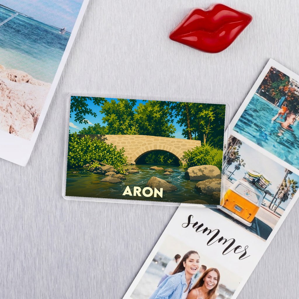Magnet souvenir de la ville de Aron avec une illustration stylisée d'un pont en pierre.
