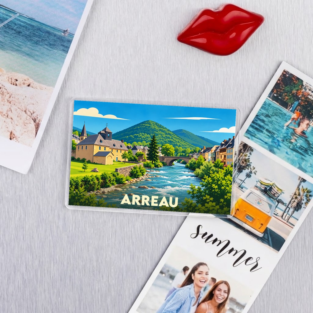 Magnet souvenir de la ville d'Arreau avec une illustration stylisée d'un paysage de montagne et de rivière.