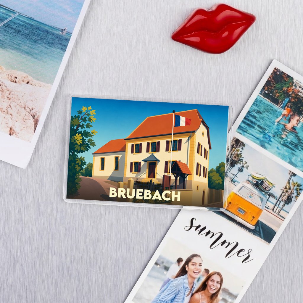 Magnet souvenir de la ville de Bruebach avec une illustration stylisée d'un bâtiment arborant le drapeau français.