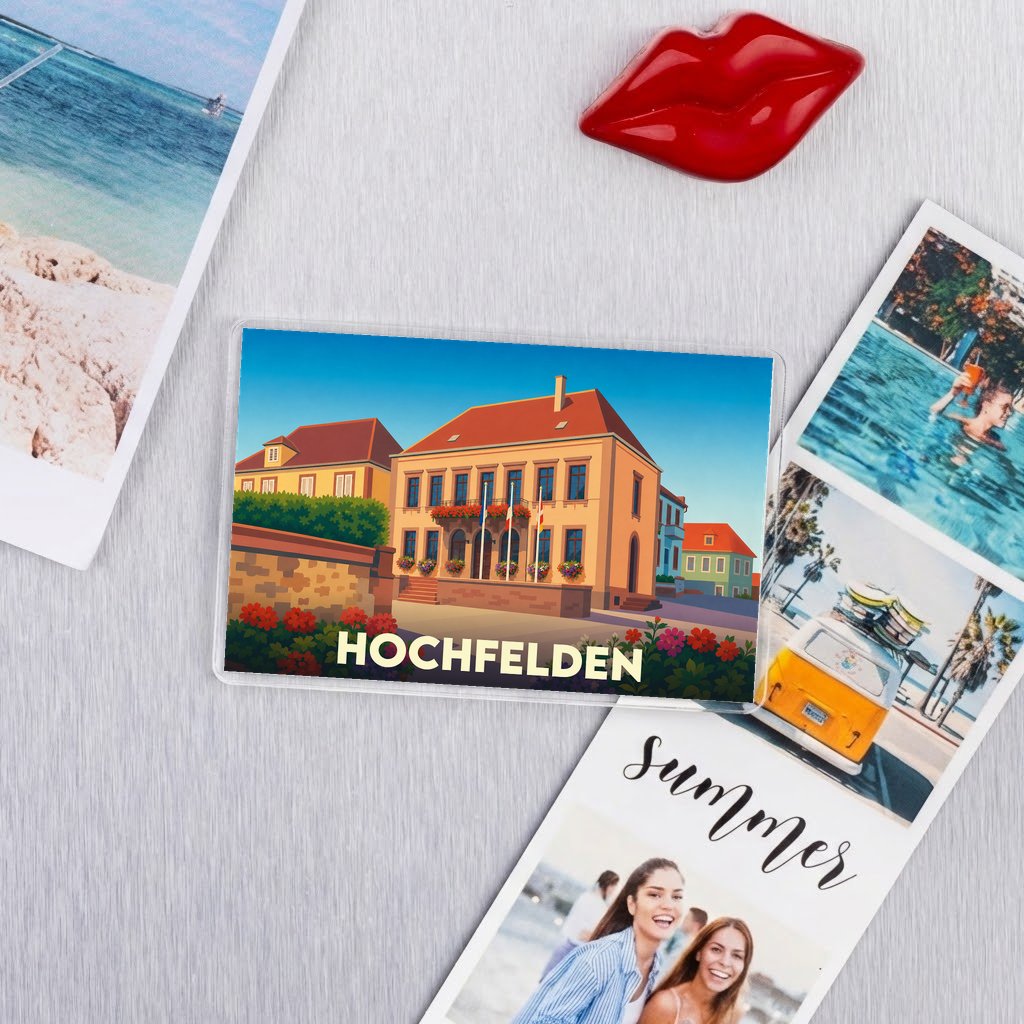 Magnat souvenir de la ville de Hochfelden avec une illustration stylisée de son hôtel de ville.