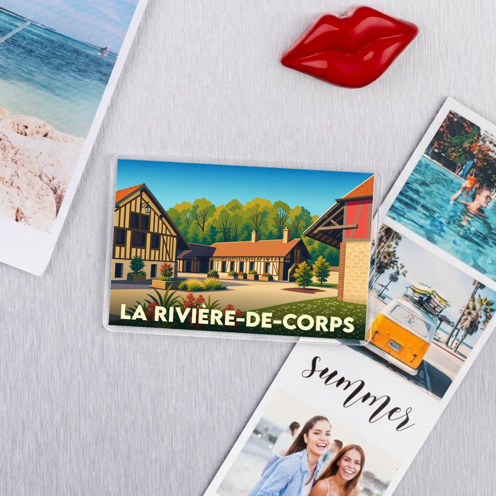 Magnet souvenir de la ville de La Rivière-de-Corps avec une illustration stylisée de maisons à colombages.