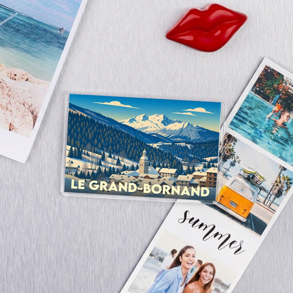 Magnet souvenir de la ville de Le Grand-Bornand avec une illustration stylisée d'un paysage de montagne enneigé.