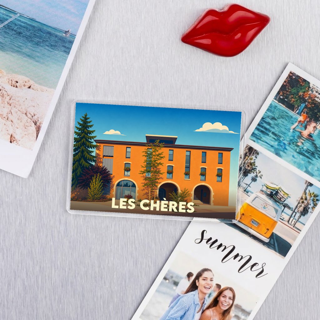 Magnet souvenir de la ville de Les Chères avec une illustration stylisée d'un bâtiment orange.