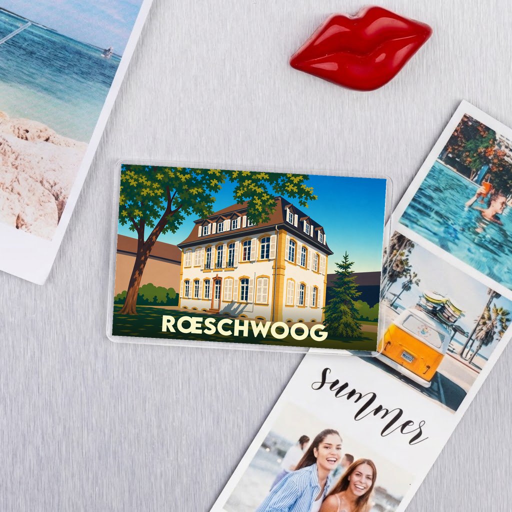 Magnat souvenir de la ville de Rœschwoog avec une illustration stylisée d'un bâtiment historique.