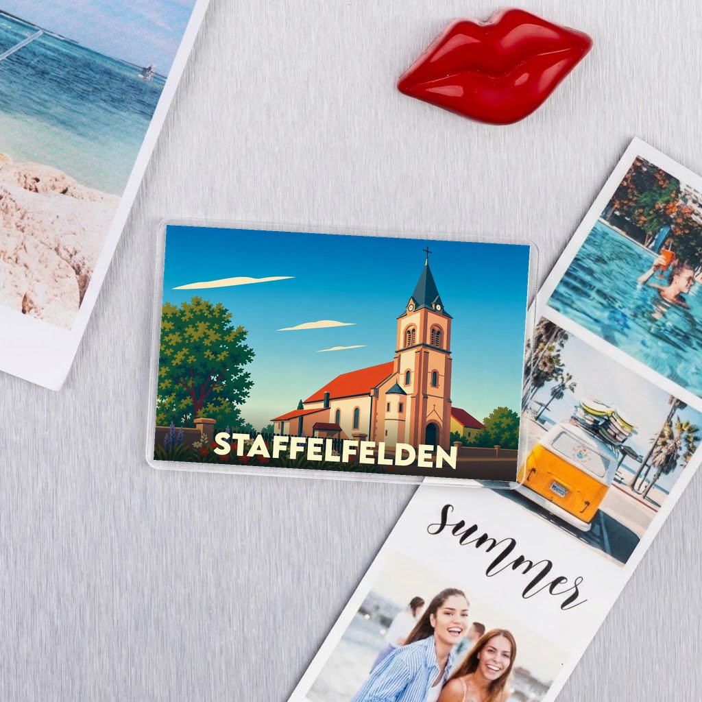 Magnet souvenir de la ville de Staffelfelden avec une illustration stylisée de son église.