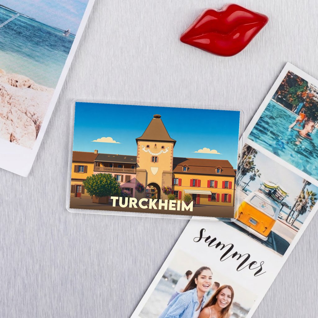 Magnet souvenir de la ville de Turckheim avec une illustration stylisée.