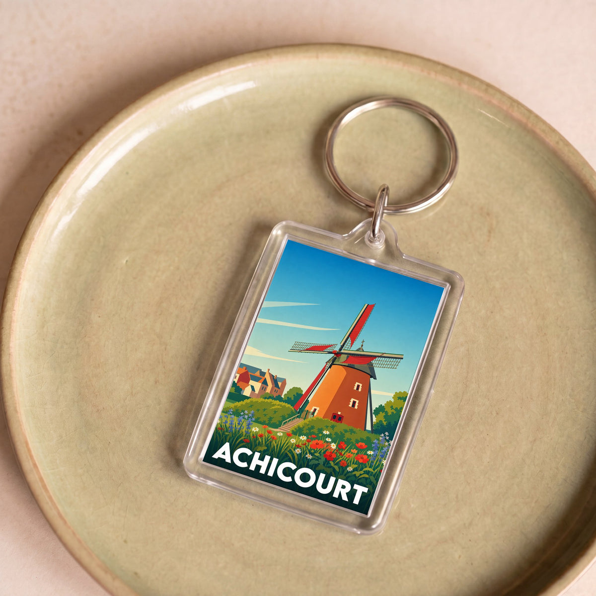 Porte-clés souvenir de la ville d'Achicourt avec une illustration stylisée d'un moulin.