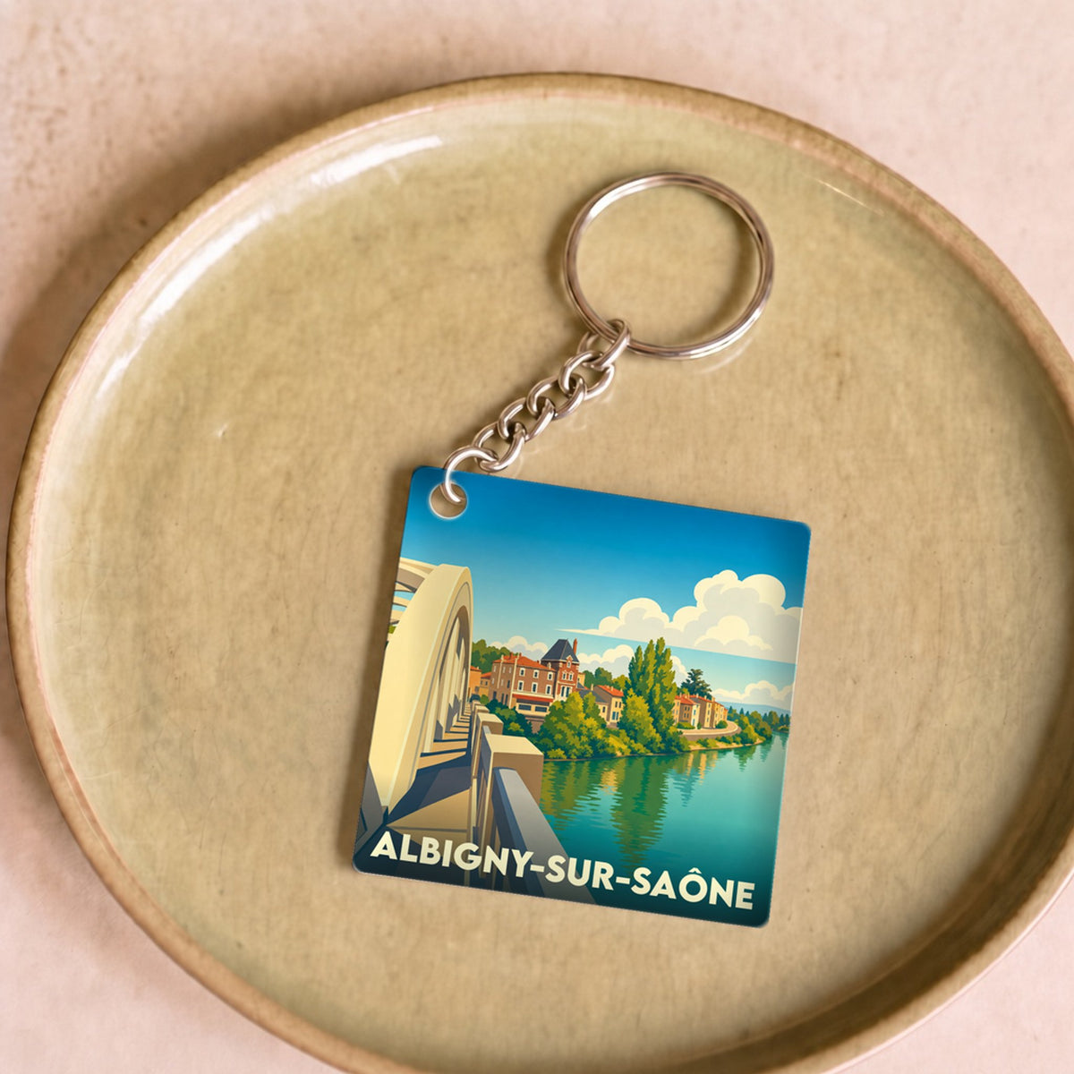 Porte-clés souvenir de la ville d'Albigny-sur-Saône avec une illustration stylisée.