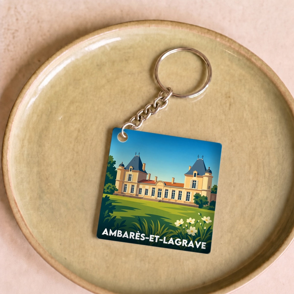 Porte-clés souvenir de la ville d'Ambarès-et-Lagrave avec une illustration stylisée.