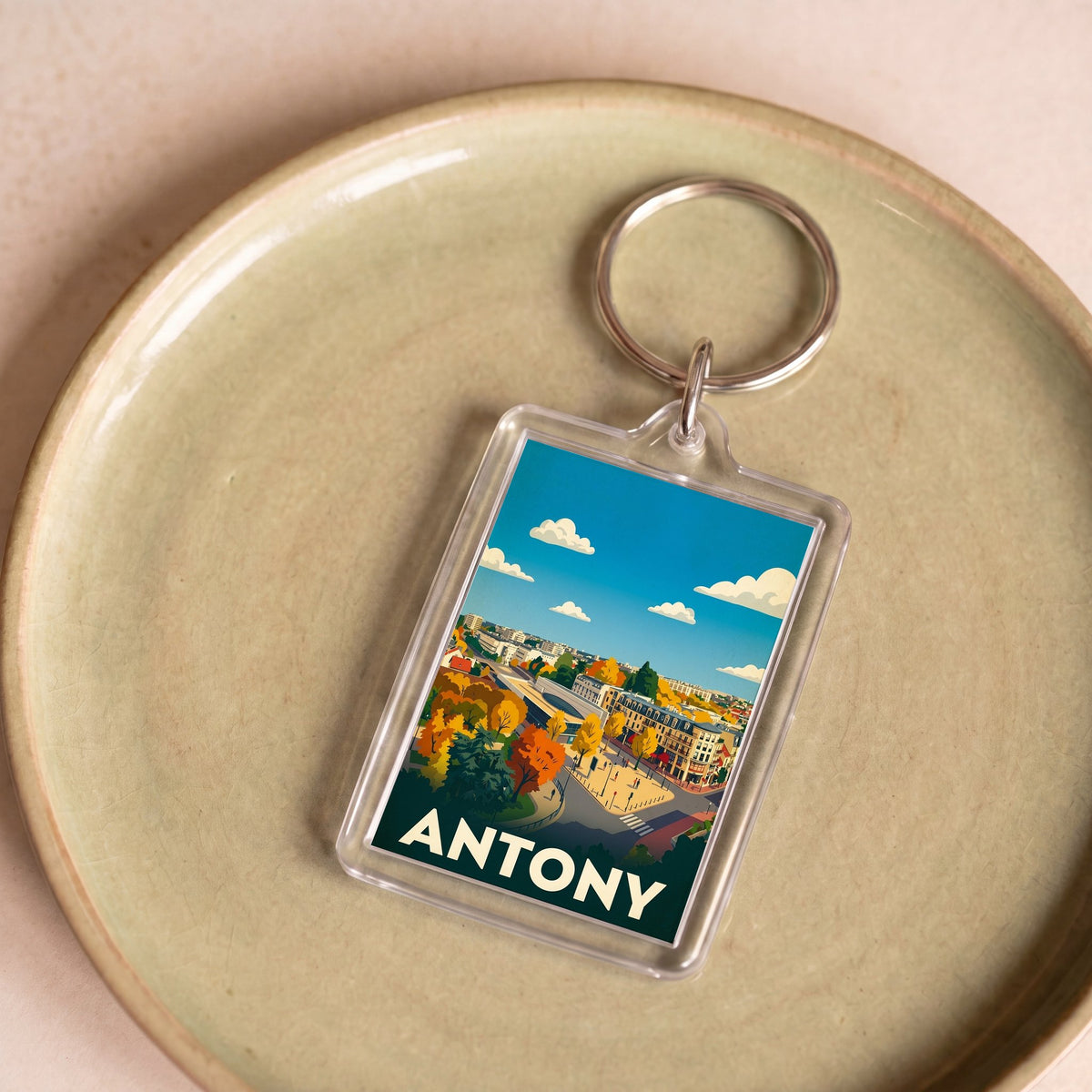 Porte-clés souvenir de la ville de Antony avec une illustration stylisée et colorée.