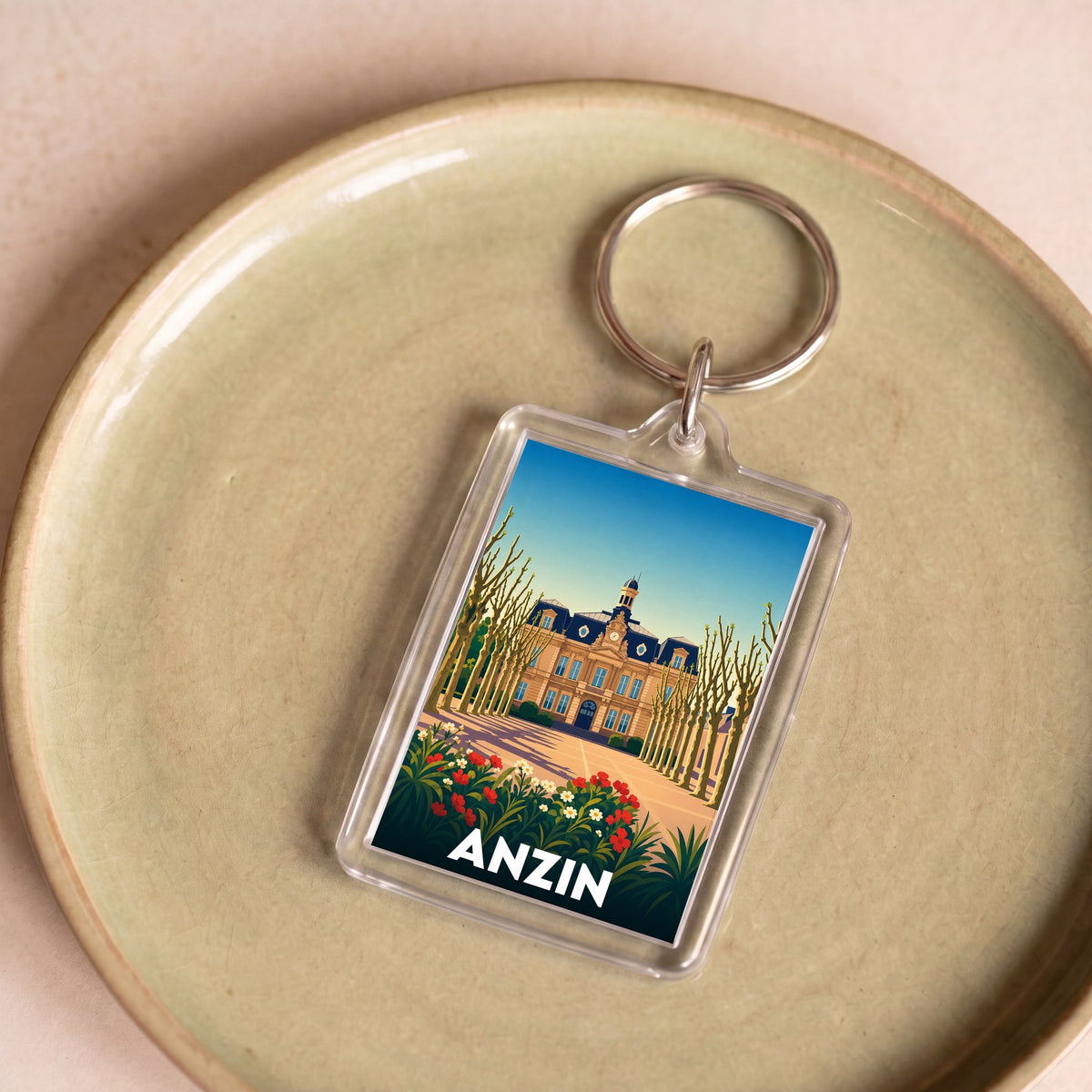 Porte-clés souvenir de la ville de Anzin avec une illustration stylisée.