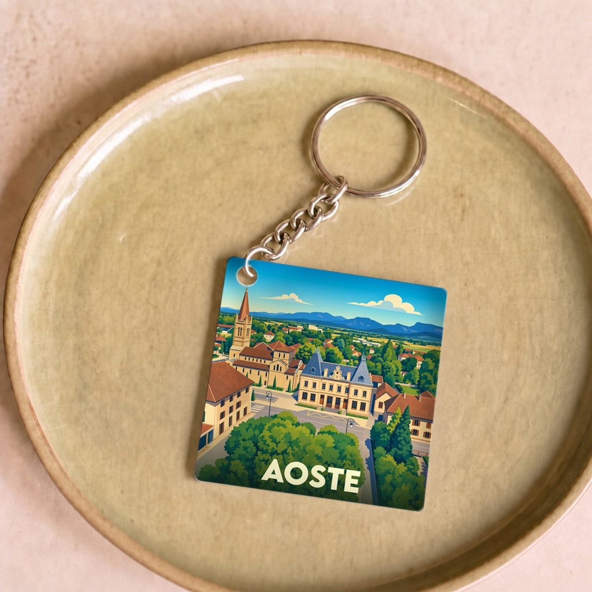 Porte-clés souvenir de la ville d'Aoste avec une illustration stylisée.