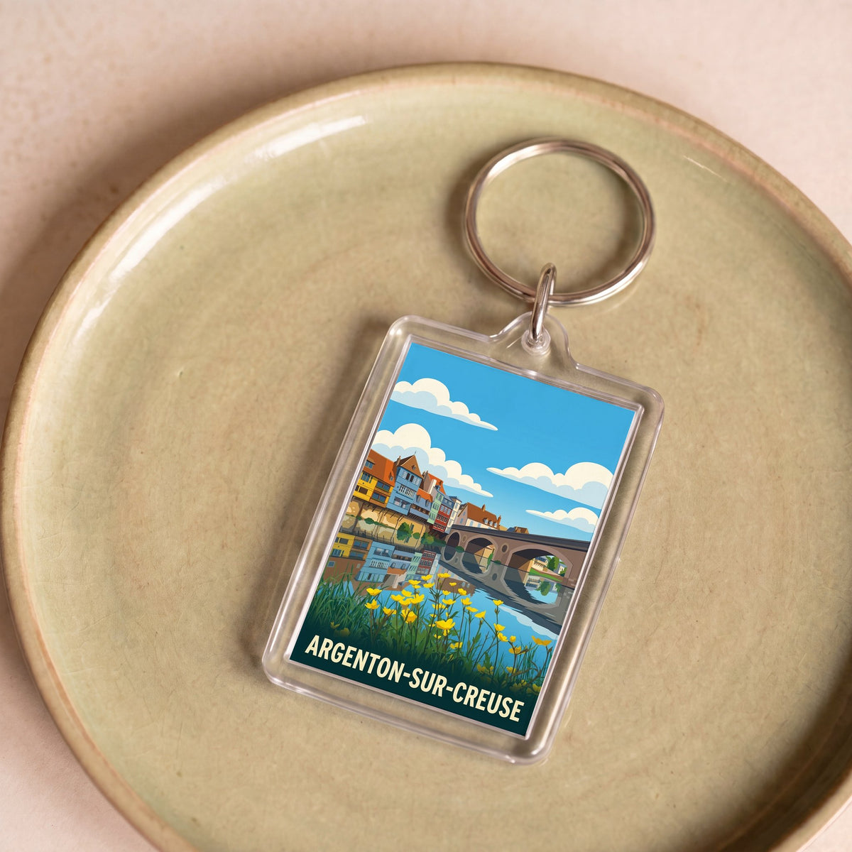 Porte-clés souvenir de la ville d'Argenton-sur-Creuse avec une illustration stylisée.