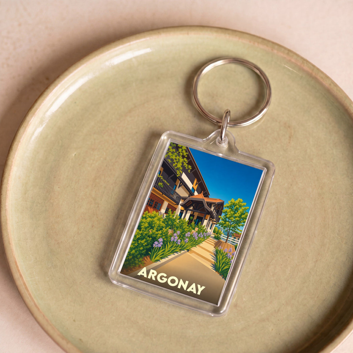 Porte-clés souvenir de la ville d'Argonay avec une illustration stylisée.