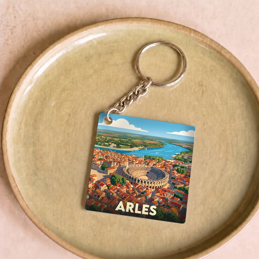 Porte-clés souvenir de la ville d'Arles avec une illustration stylisée.