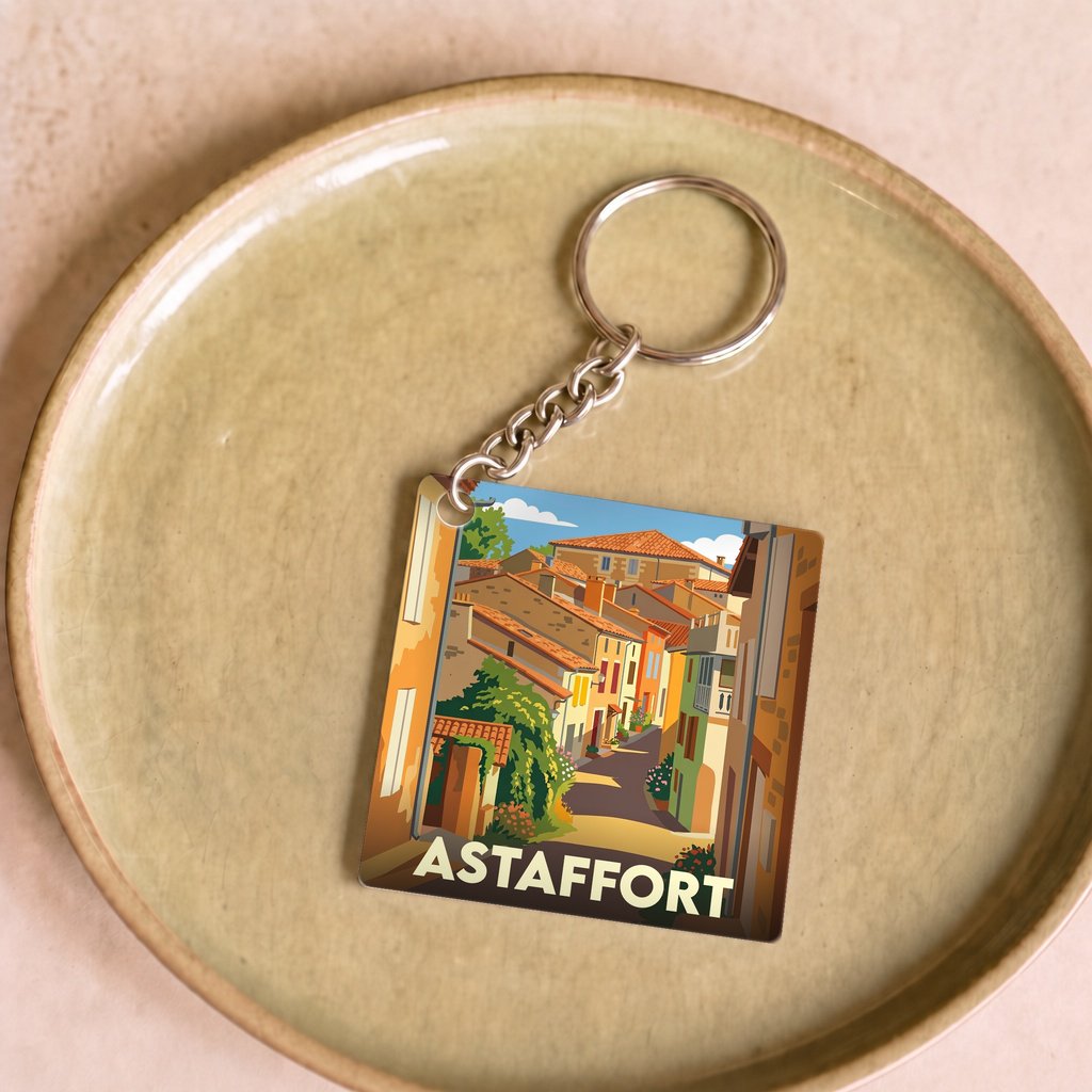 Porte-clés souvenir de la ville d'Astaffort avec une illustration stylisée.