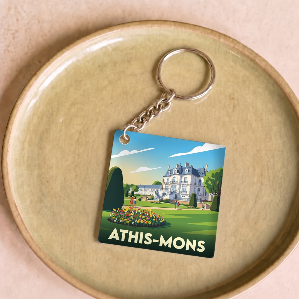 Porte-clés souvenir de la ville d'Athis-Mons avec une illustration stylisée.